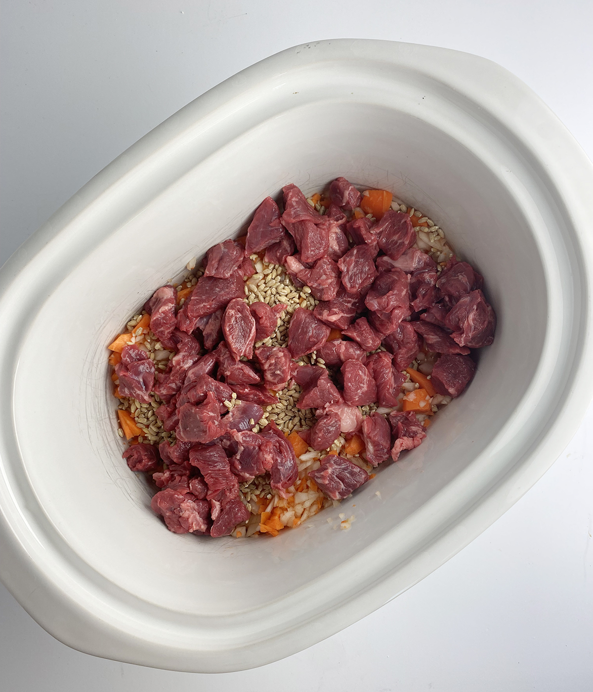 Beef bacon soup ingredients in the slow cooker.