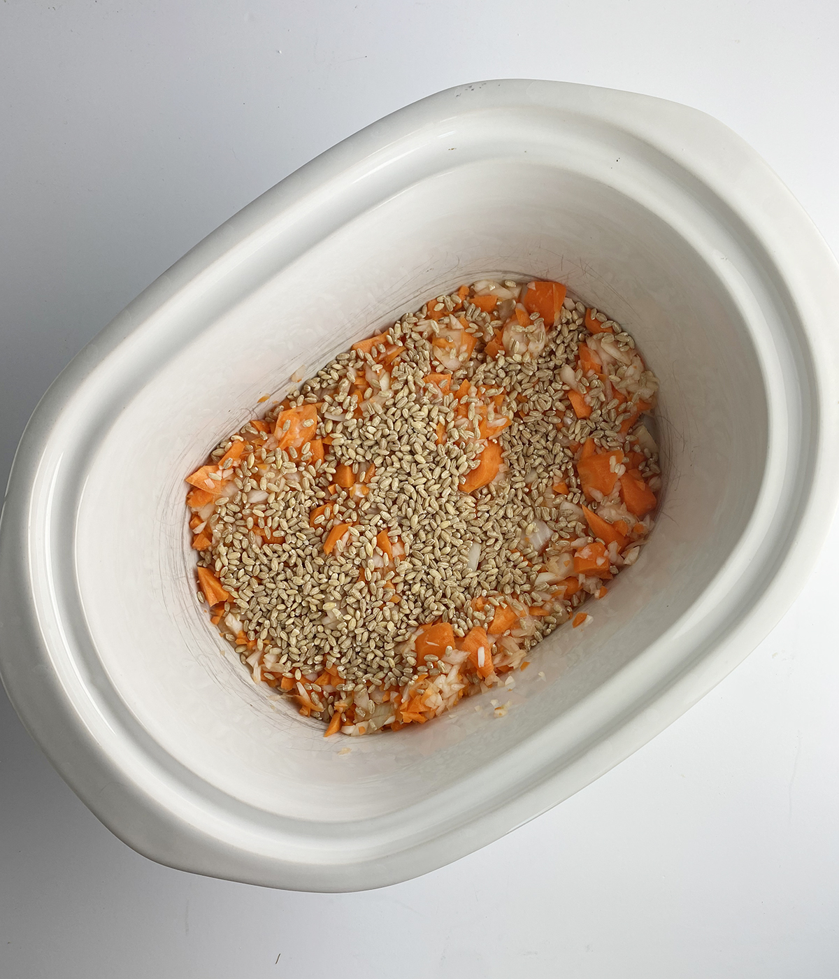 Vegetable and barley mixture in a slow cooker.