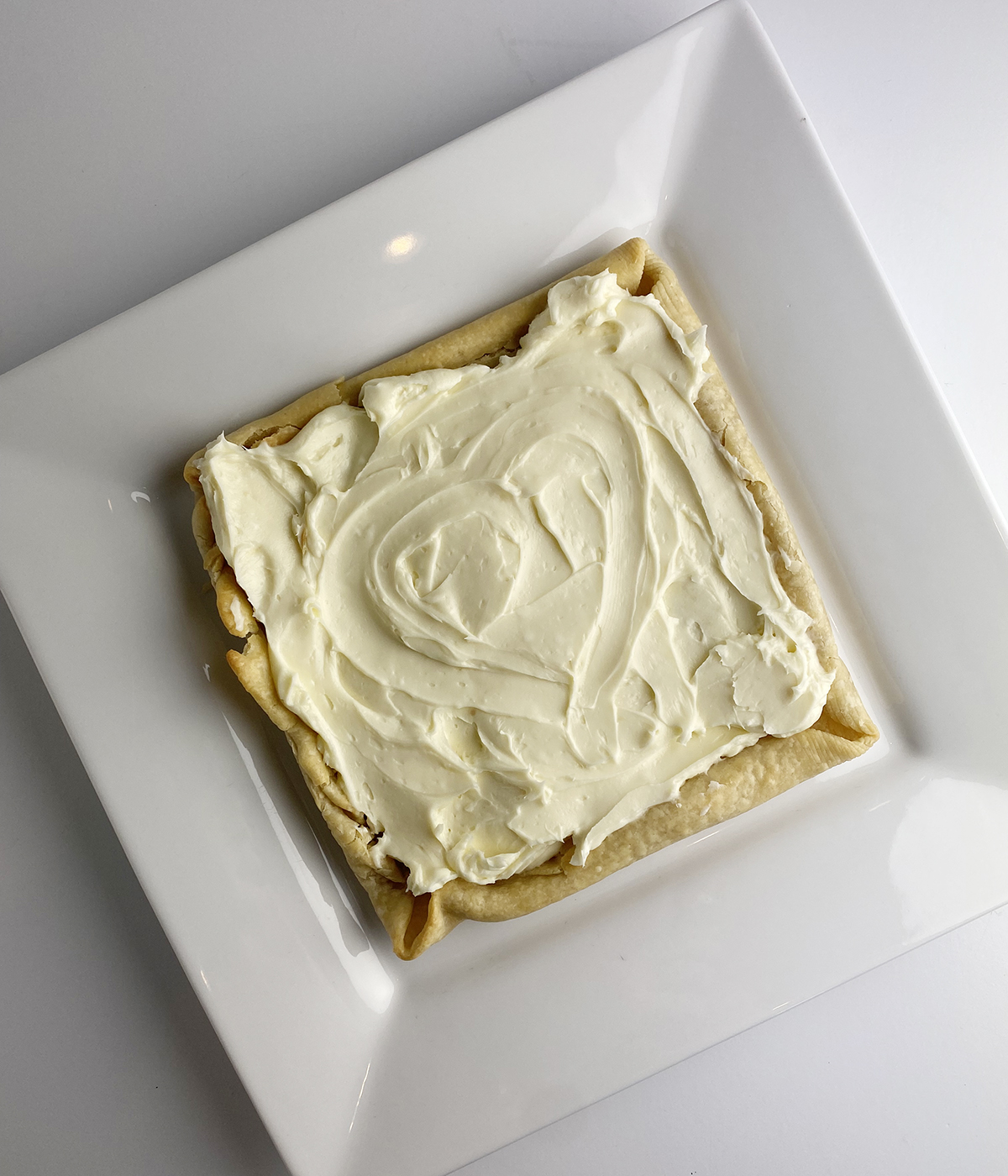 Baked pie crust spread with cream cheese mixture.