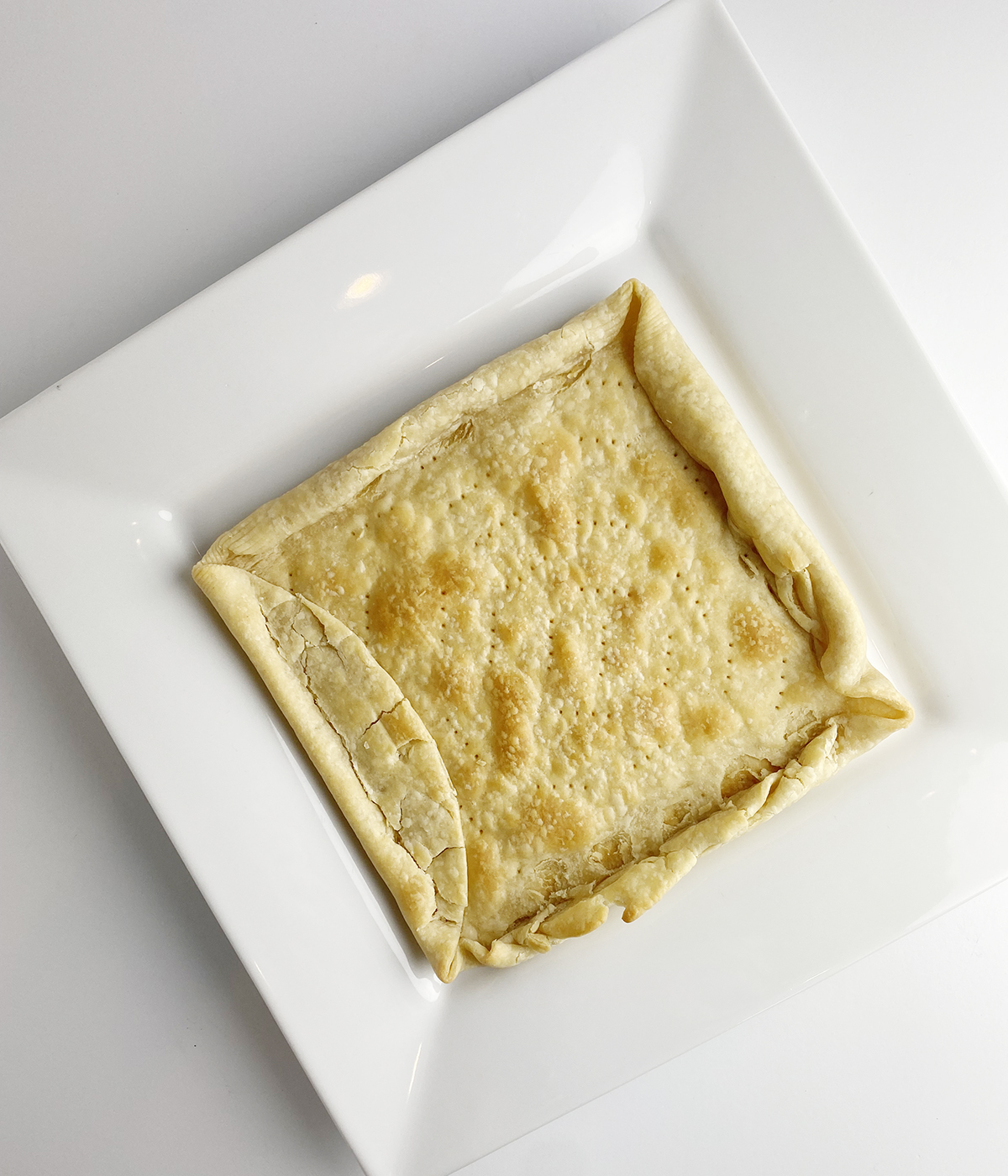 Baked square pie crust.