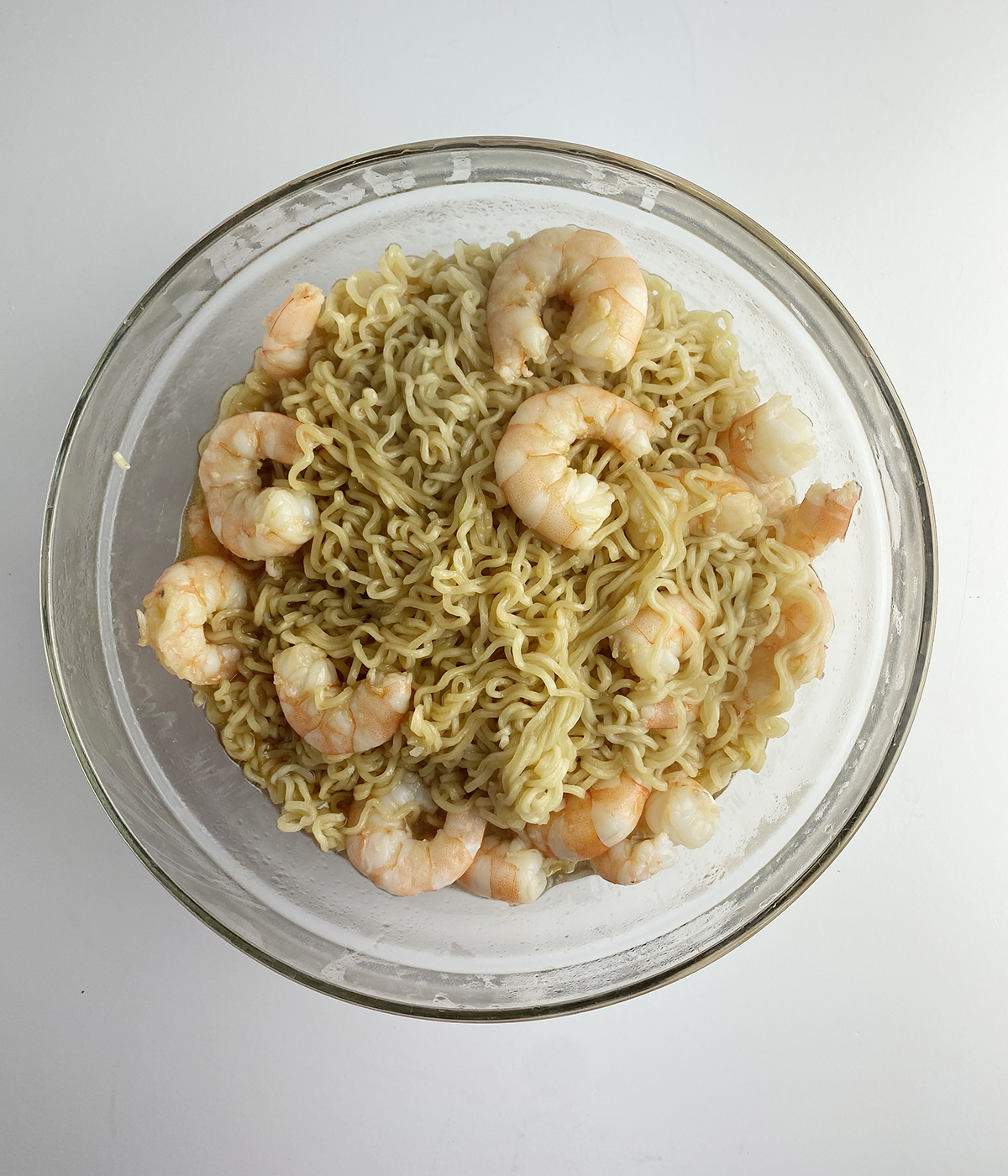 Shrimp and ramen noodles in a bowl.