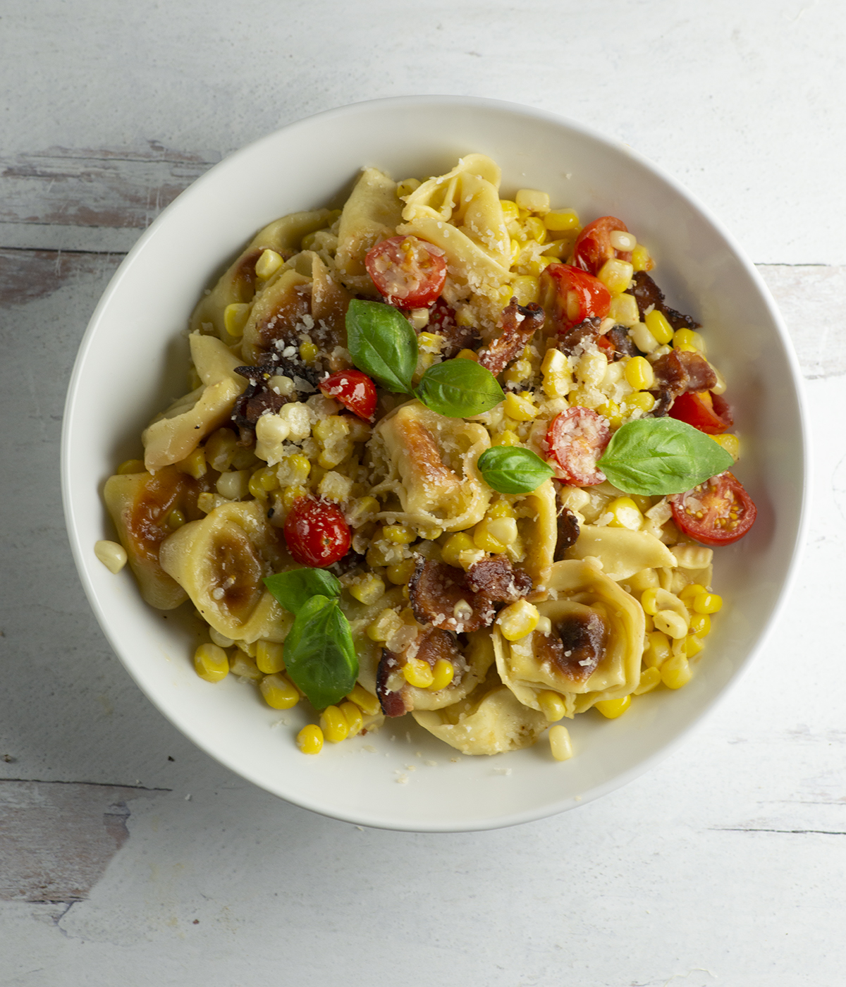 Bowl of pan fried tortellini.