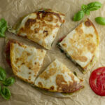 Caprese Quesadilla with basil and tomato.