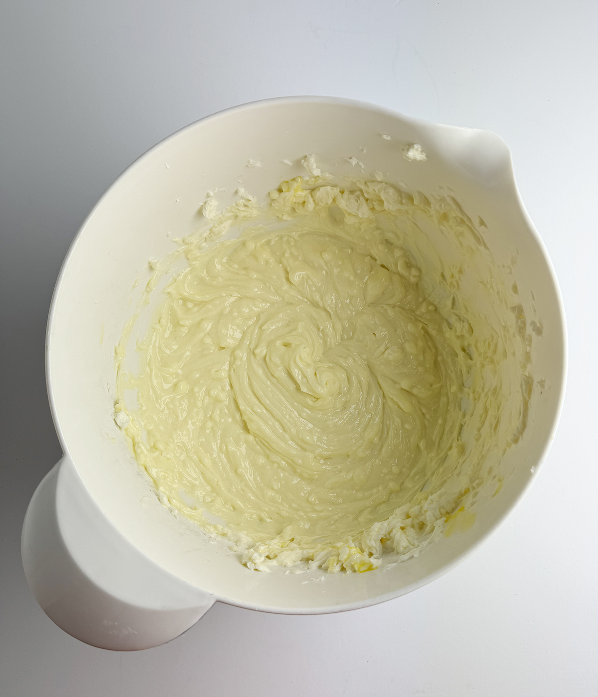 Cheesecake batter in a mixing bowl.