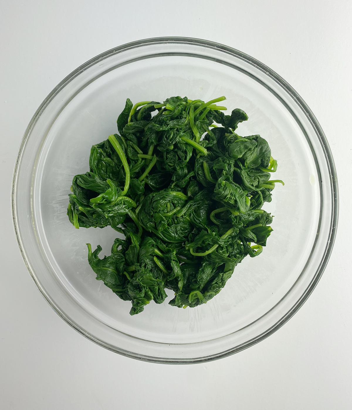 Chilled cooked spinach in a bowl.