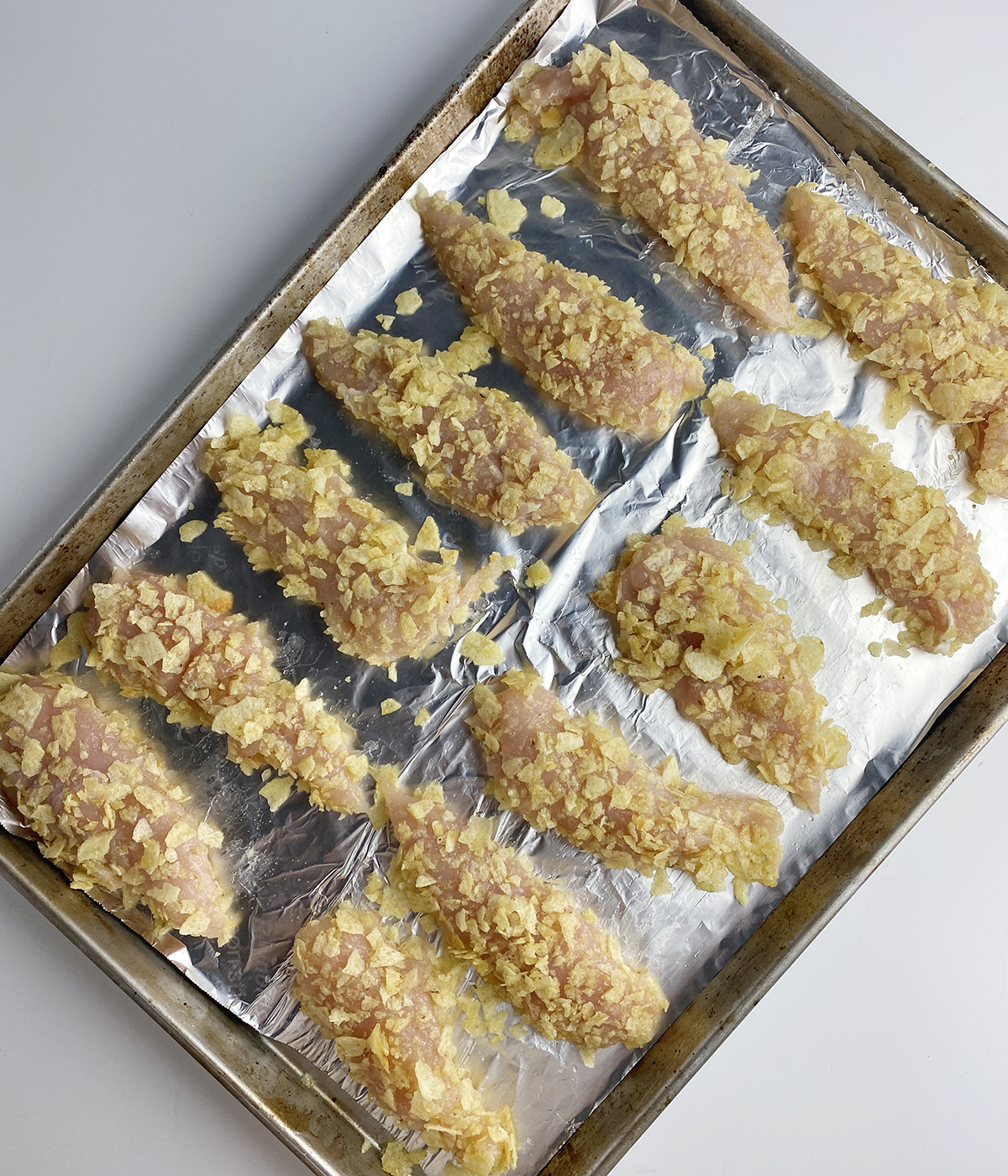 Potato Chip chicken fingers ready for the oven.
