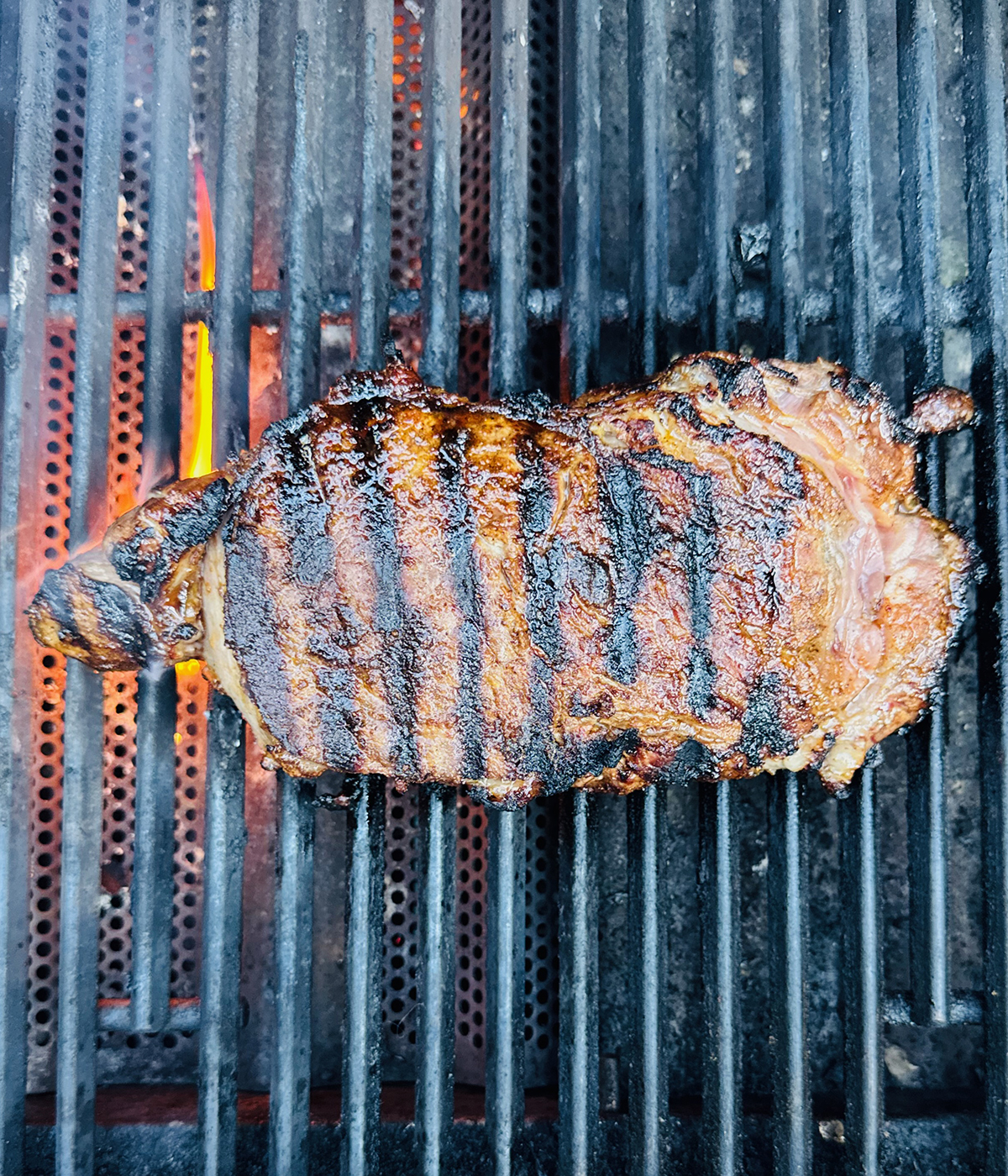 Seared steak on the grill.