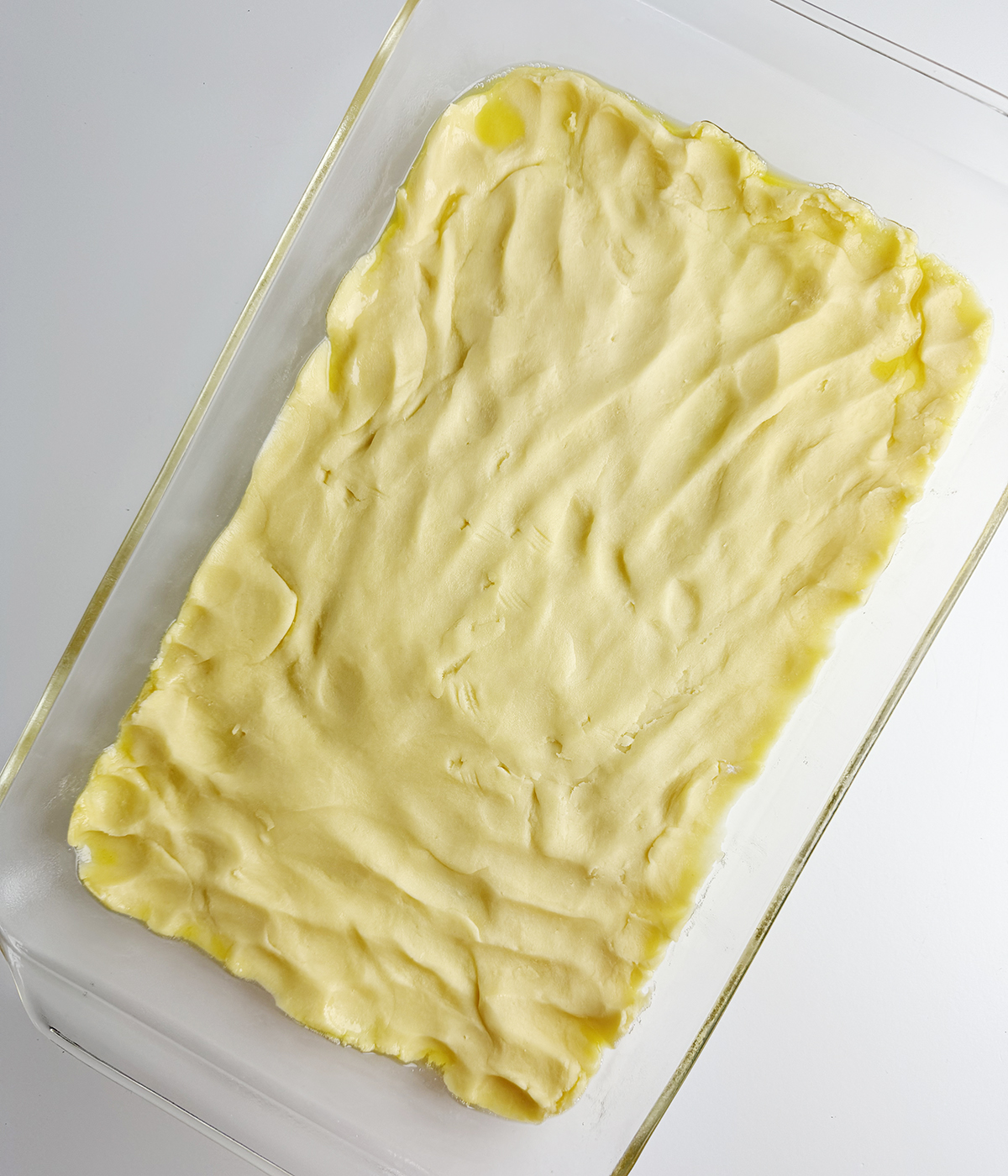 Shortbread batter pressed into a baking pan.