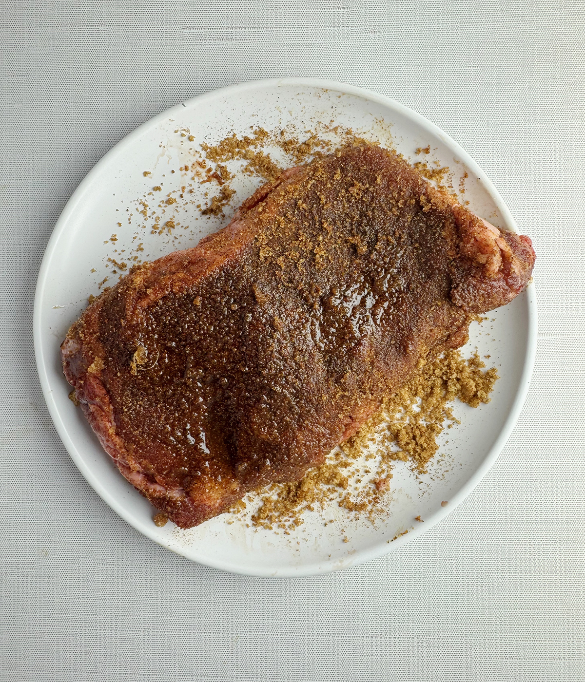 Spiced rubbed steak on a plate.