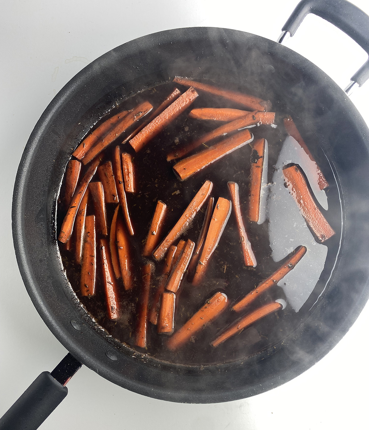 Carrots cooking in red wine.