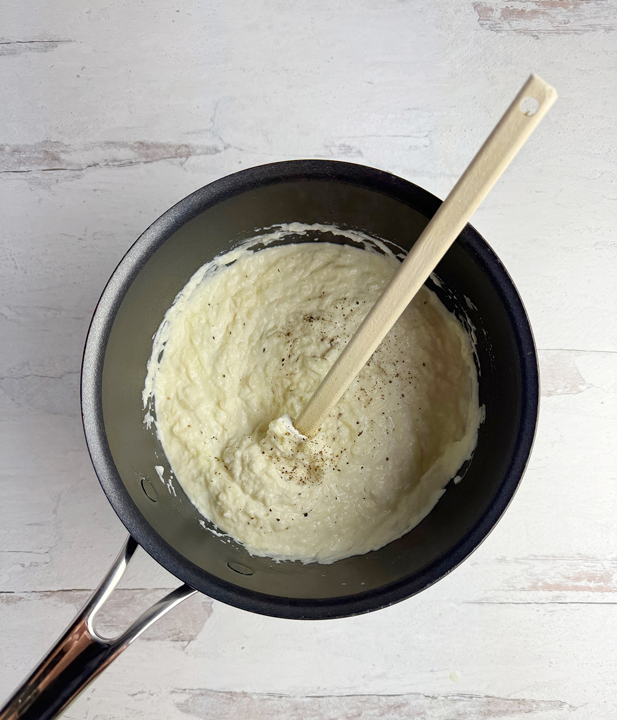 Cheese mixture in a pot.