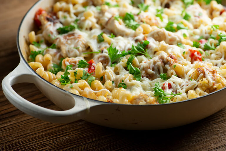 Chicken parmesan pasta in a skillet.