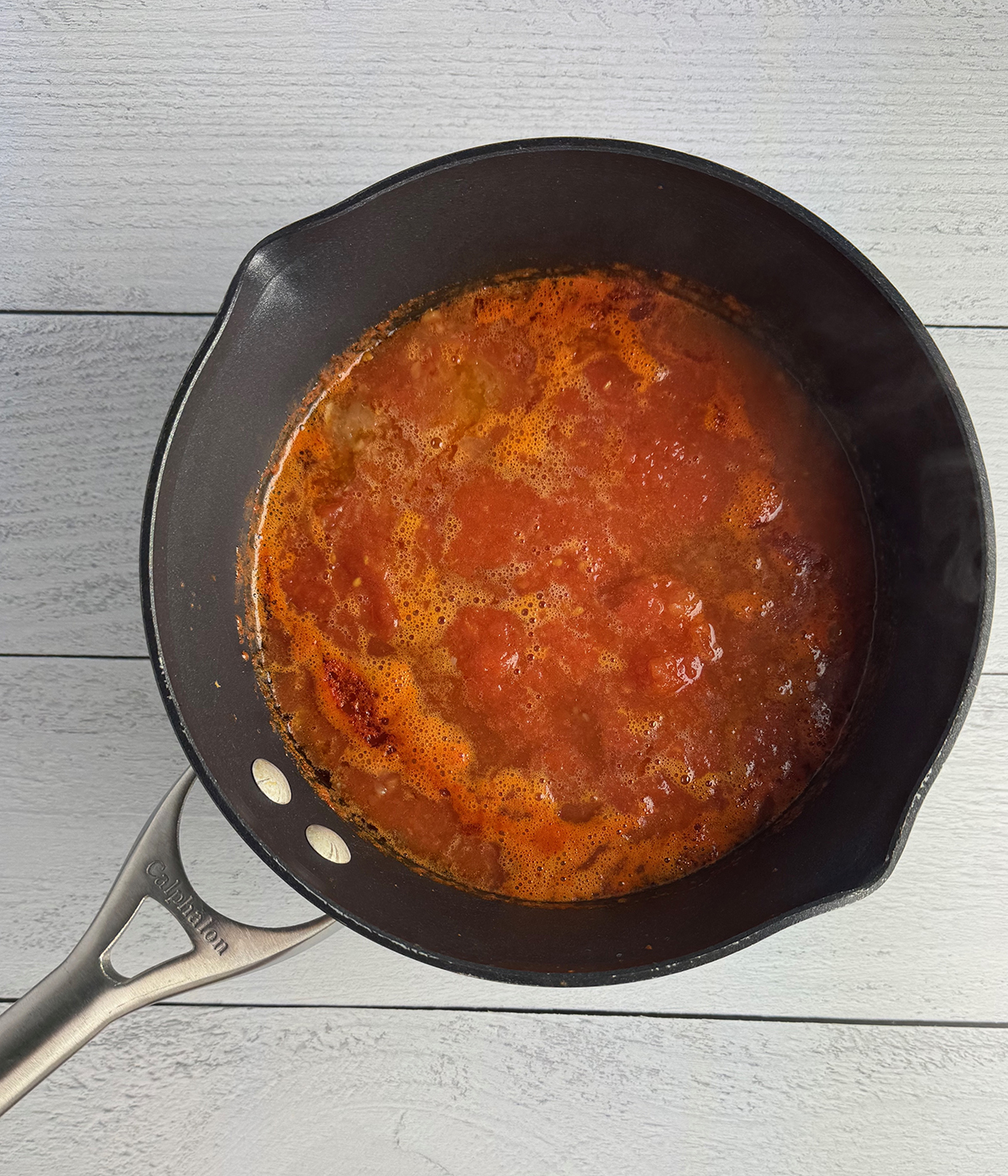 Cooked tomatoes in a pot.