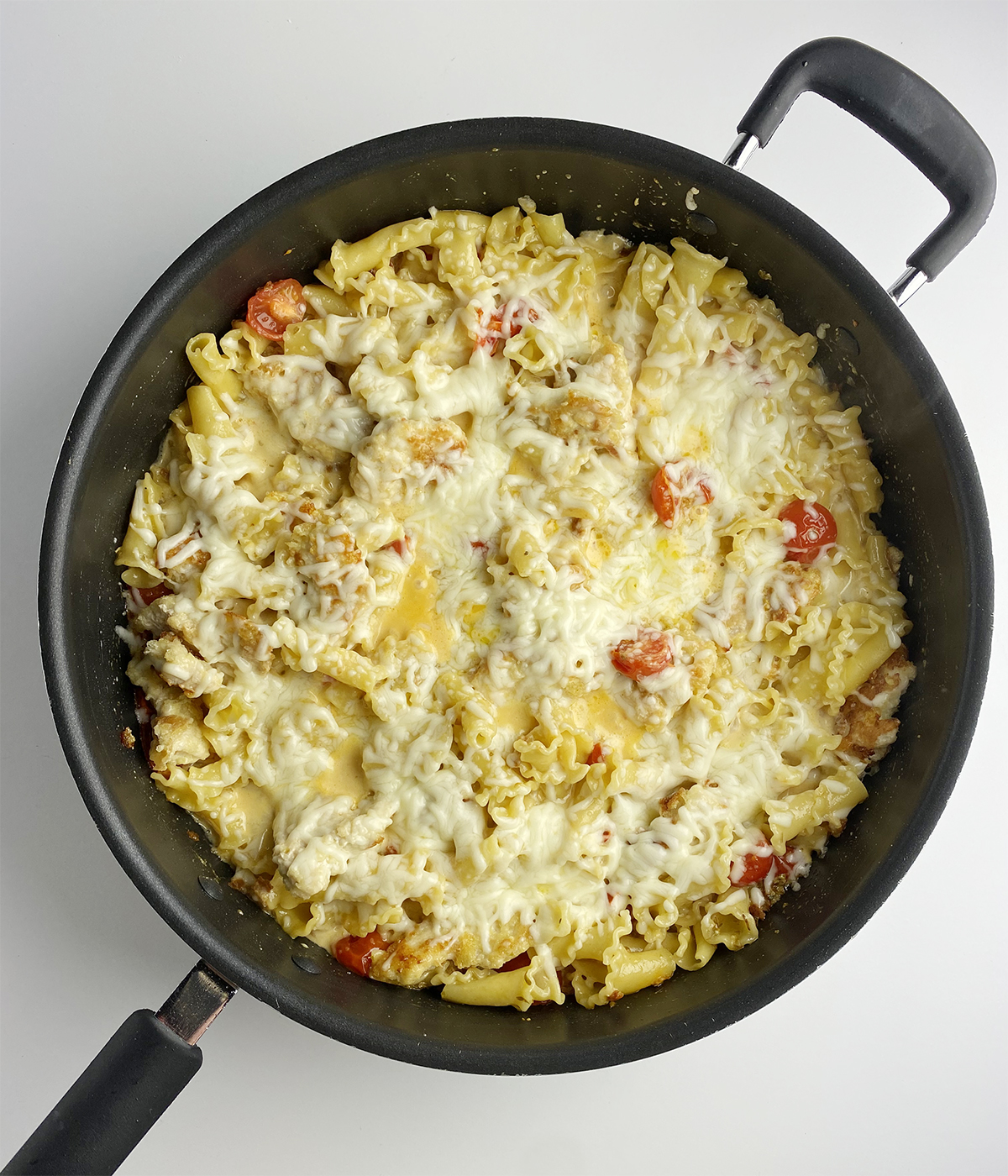 Finished Chicken Parmesan Pasta in a skillet.