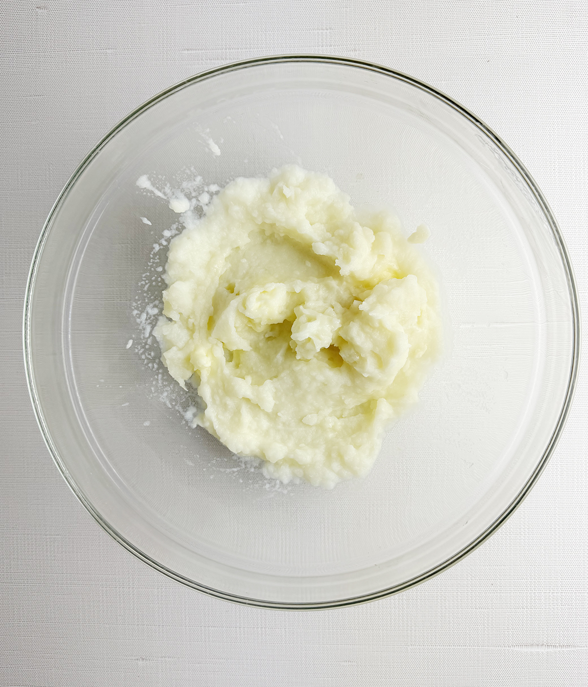 Mashed potatoes in a mixing bowl.