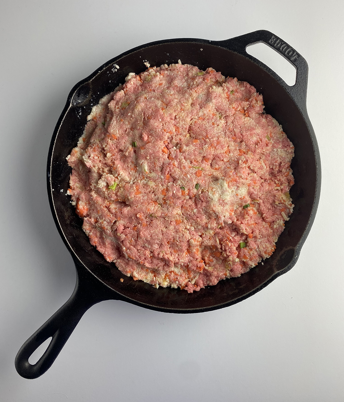Meatloaf mixture in a skillet.