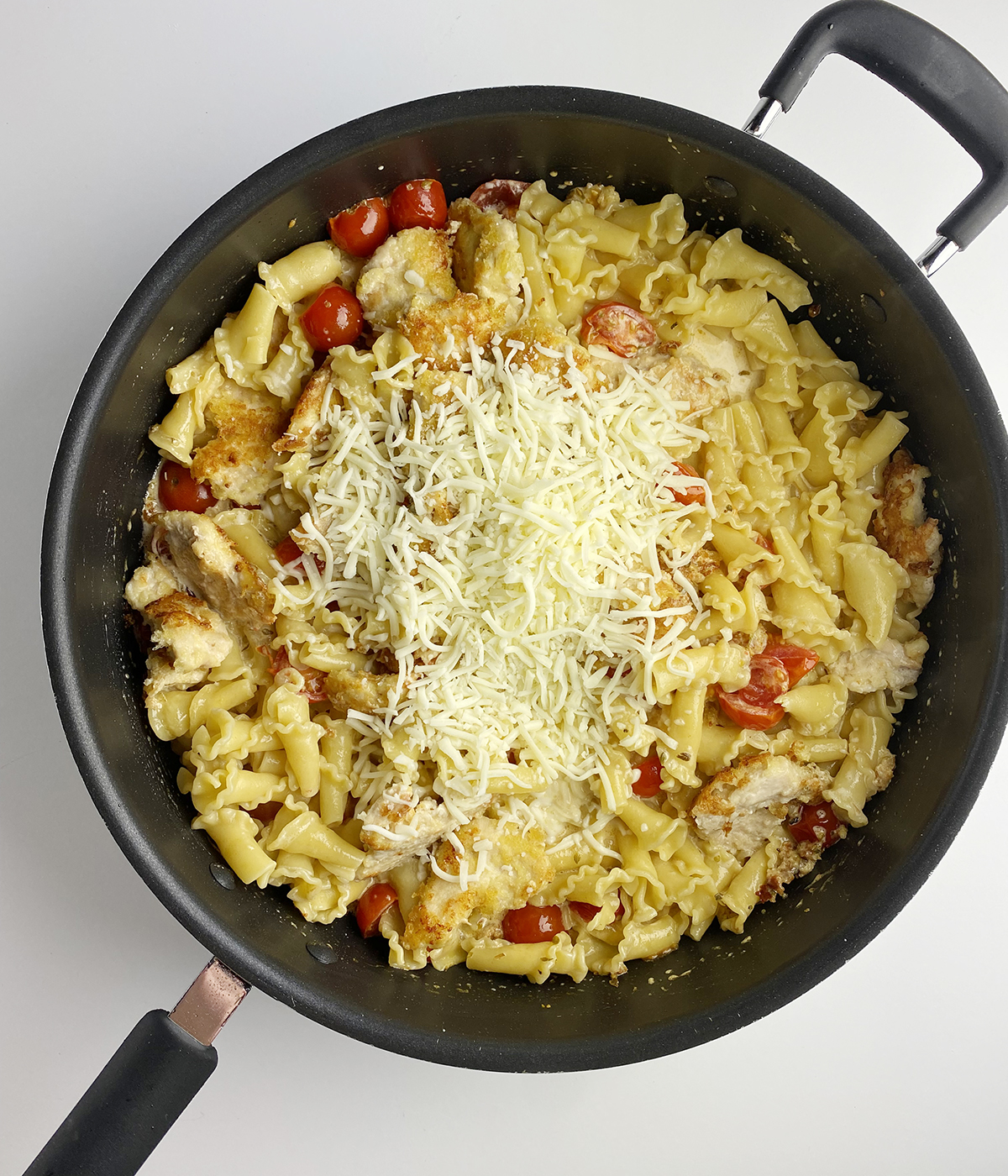 Skillet Chicken Parmesan Pasta with cheese added.