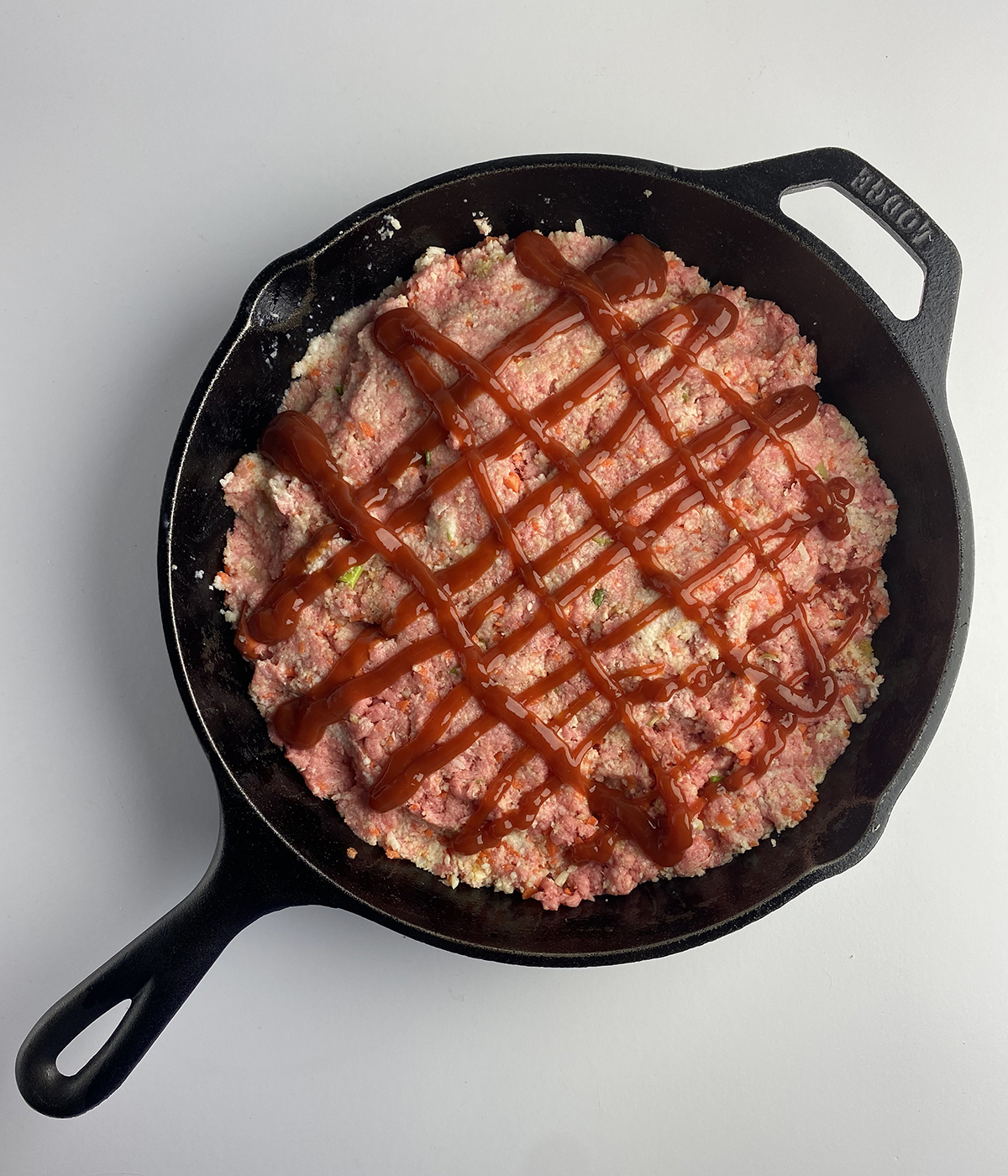 Meatloaf mixture in a skillet.