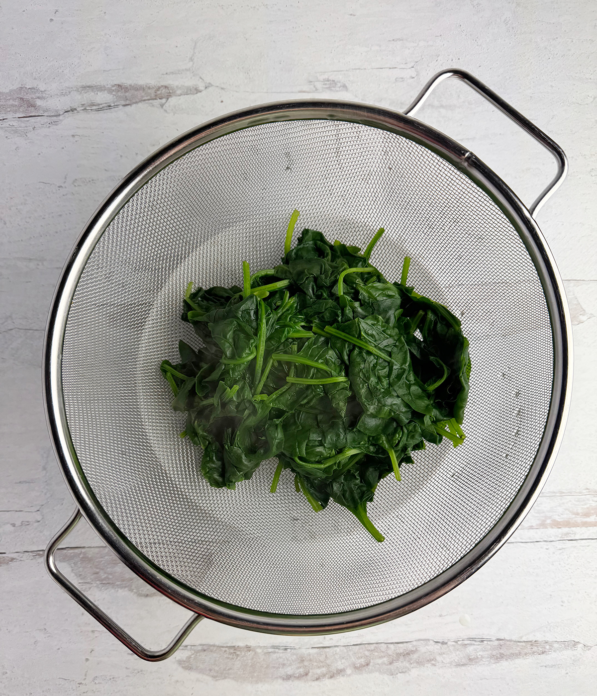 Spinach in a strainer.