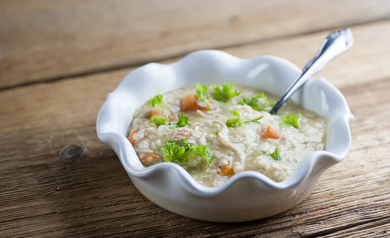 A bowl of slow cooker chicken noodle soup.