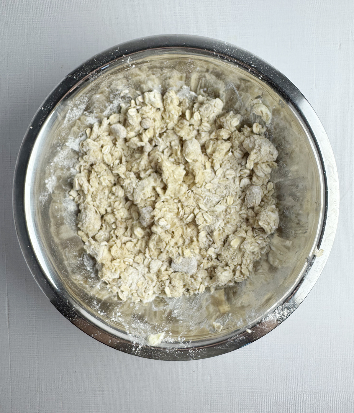 Apple crisp topping in a mixing bowl.