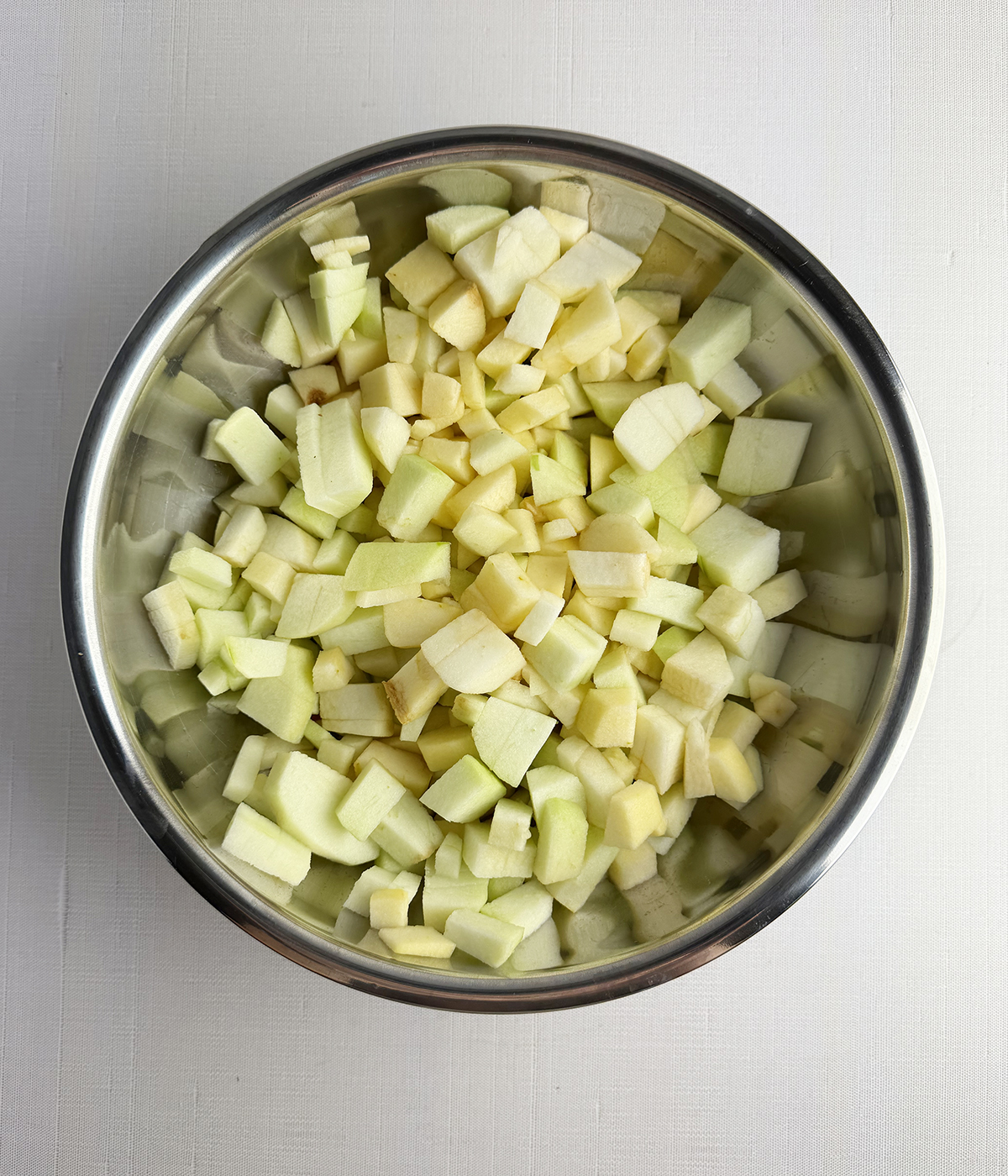 Chopped apples in a mixing bowl.