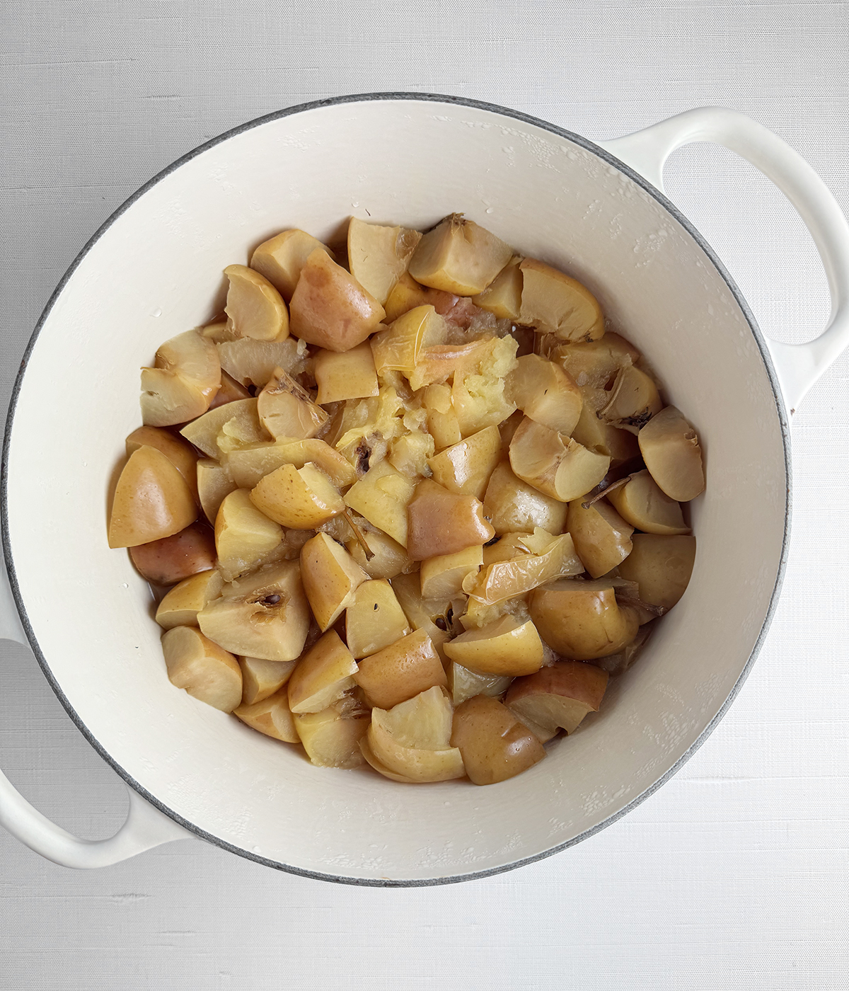 Cooked apples in a Dutch oven.