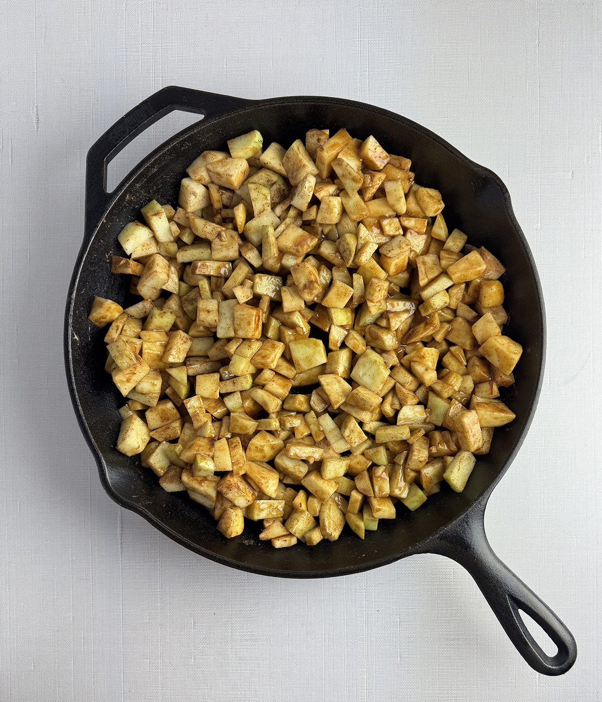 Spiced apples in a skillet.