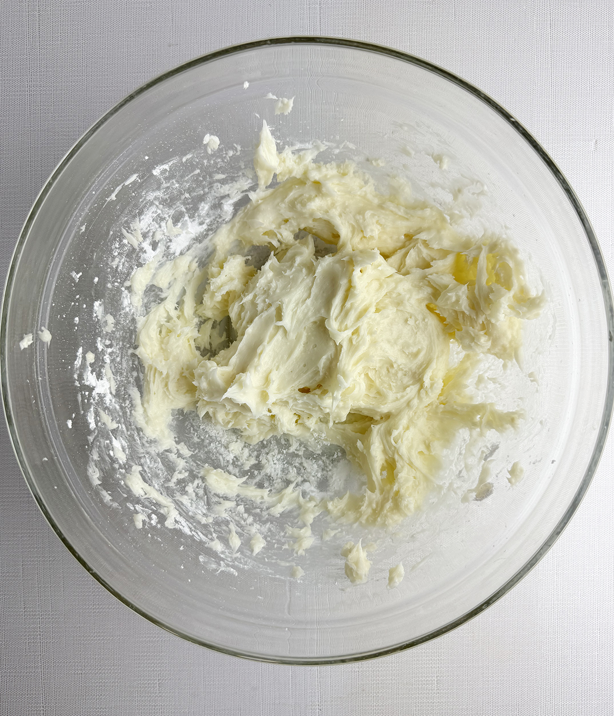 Cream cheese frosting in a bowl.