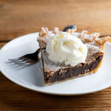 Chocolate chess pie on a plate.