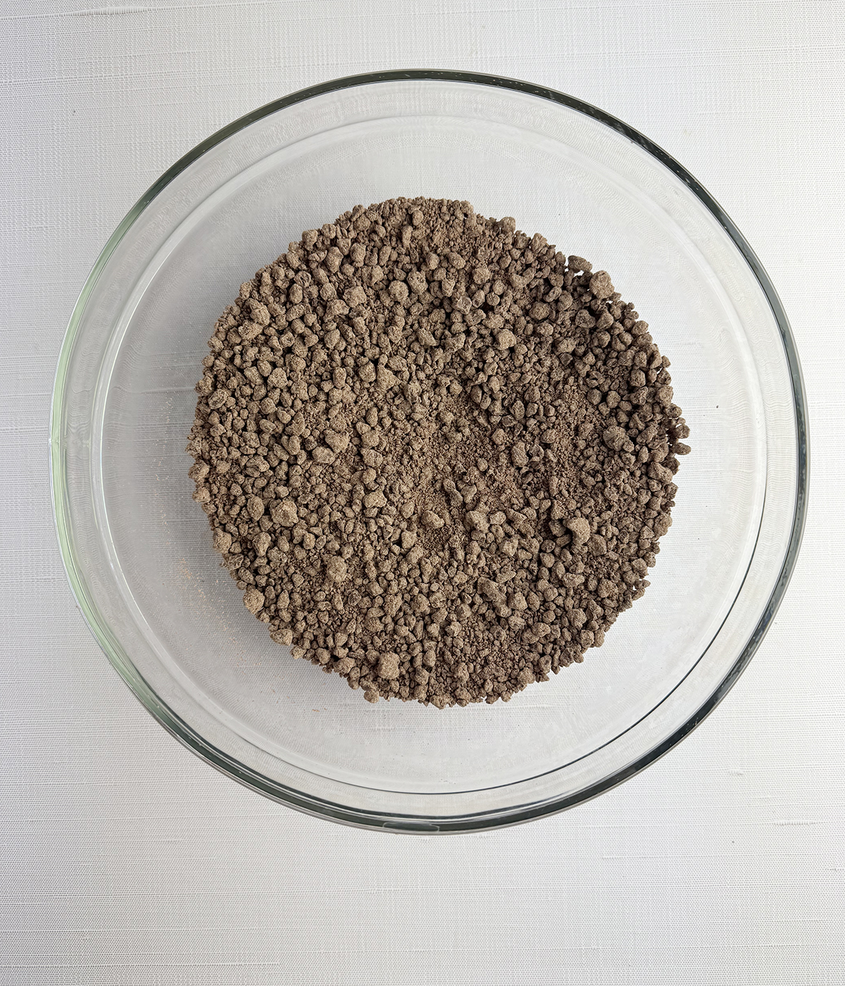 Chopped up chocolate chips in a bowl.