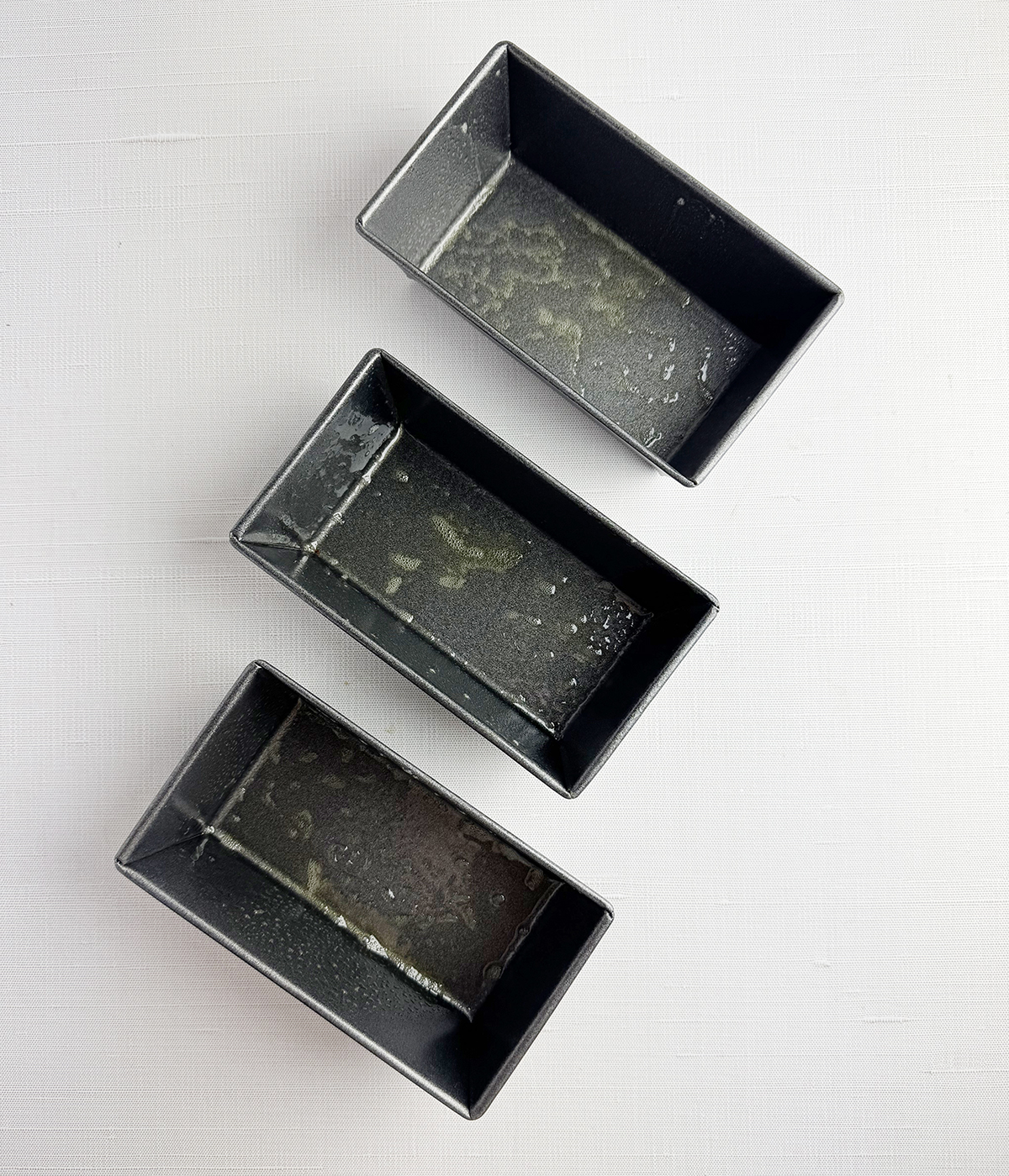 Greased mini loaf pans.