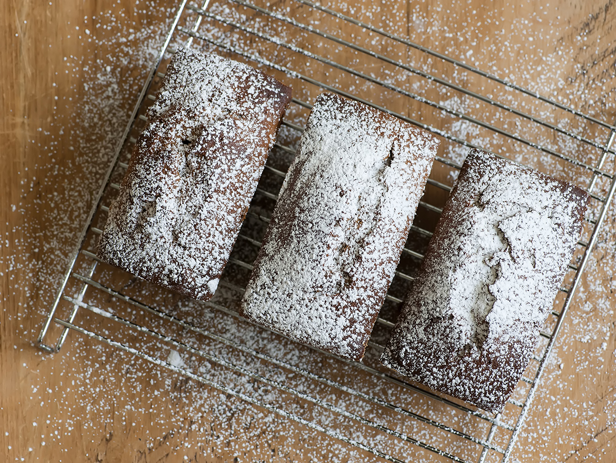 Mini banana gingerbreads with powdered sugar.