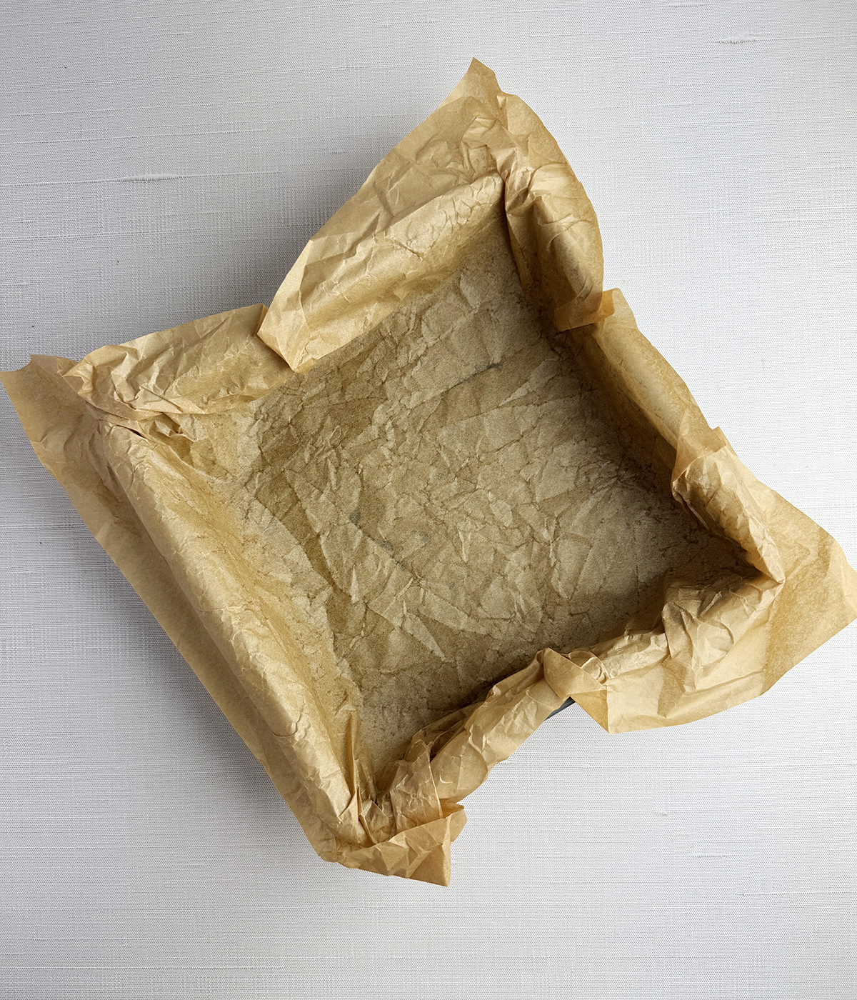 Parchment lined baking dish.