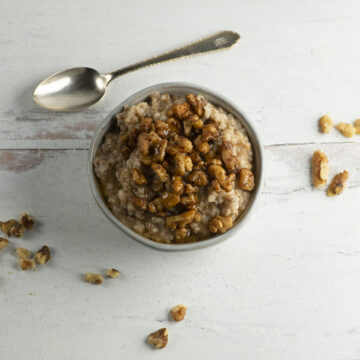 Baklava Oatmeal in a bowl with walnuts.