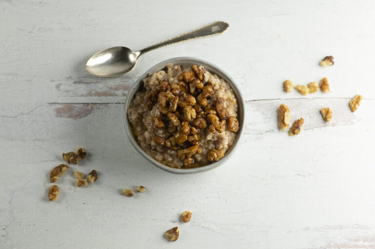 Baklava Oatmeal in a bowl with walnuts.