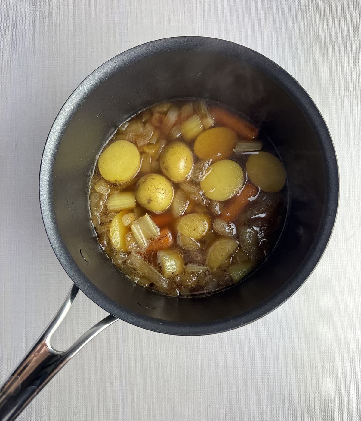 Cooked vegetables in a pot.