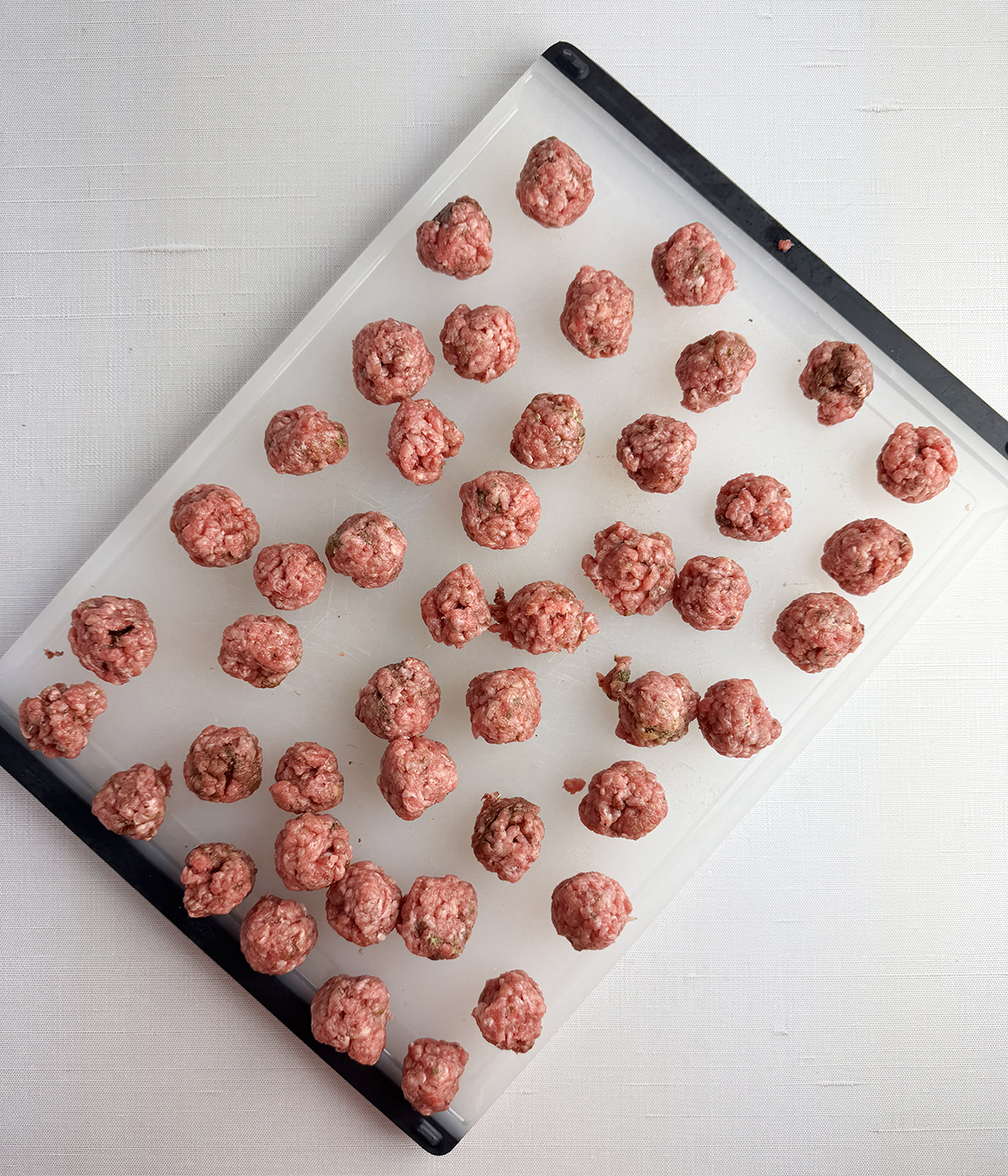 Meatballs on a cutting board.