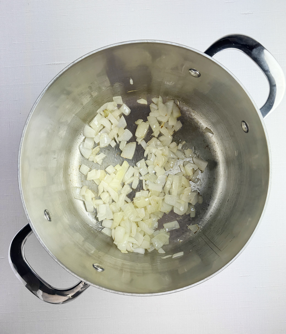 Onions cooking in a pot.