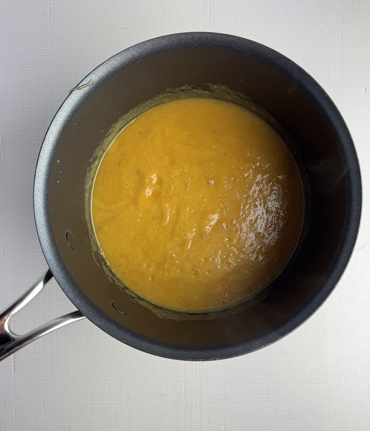 Potato cream cheese soup in a medium pot.