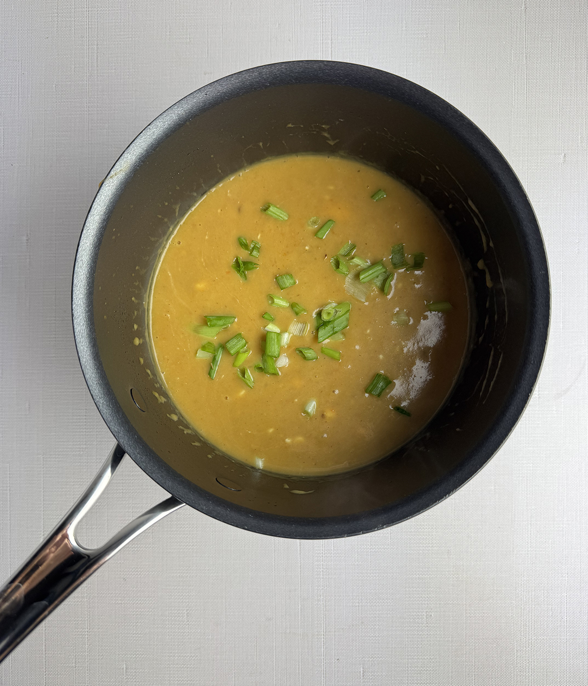 Potato cream cheese soup in a pot.