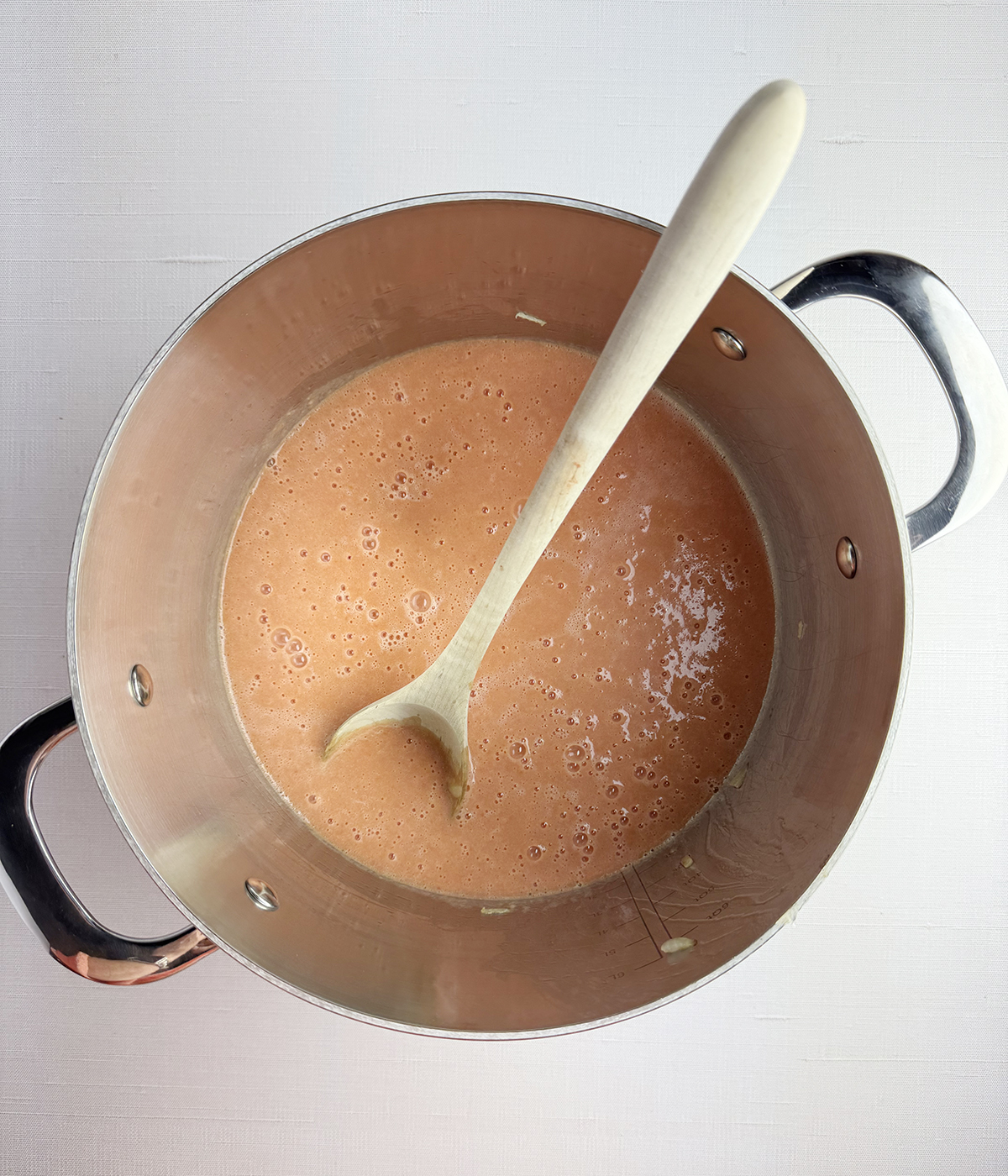 Onions cooking in a pot.