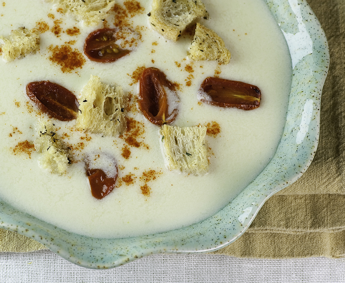 Cheddar cheese soup in a bowl.