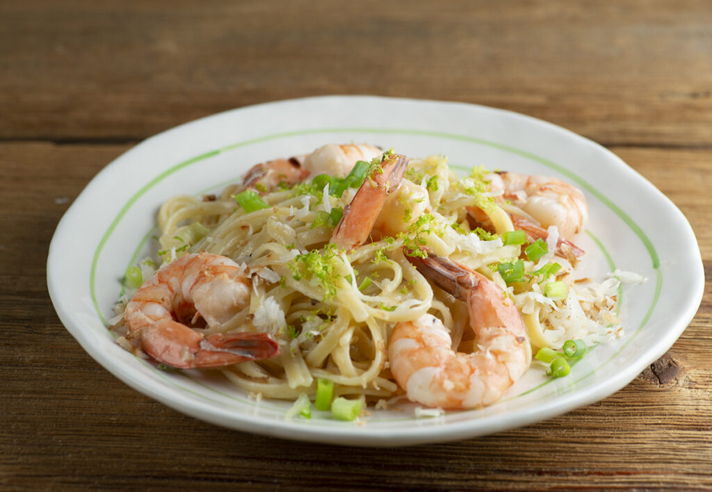 Coconut Shrimp Pasta on a white plate.