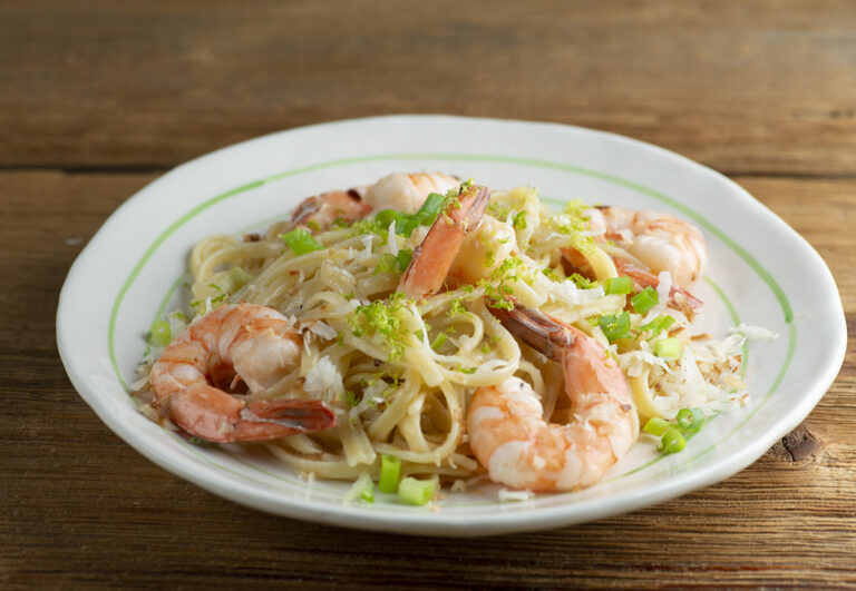 Coconut Shrimp Pasta on a white plate.