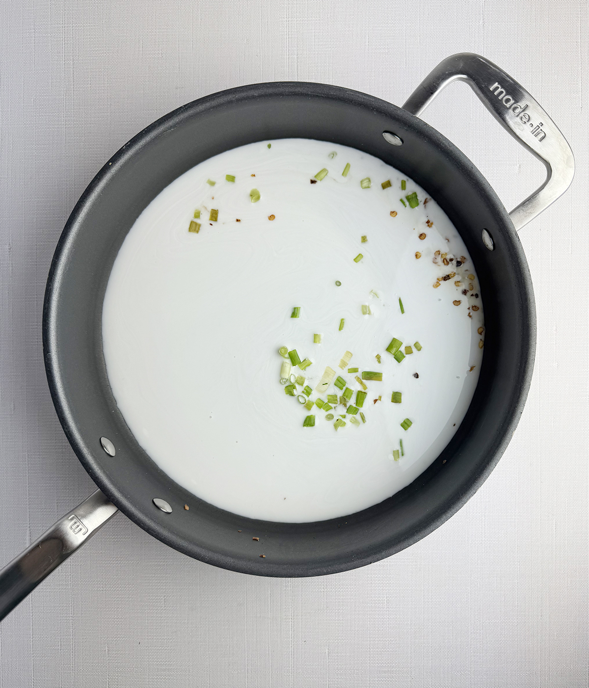 Coconut sauce in a skillet.