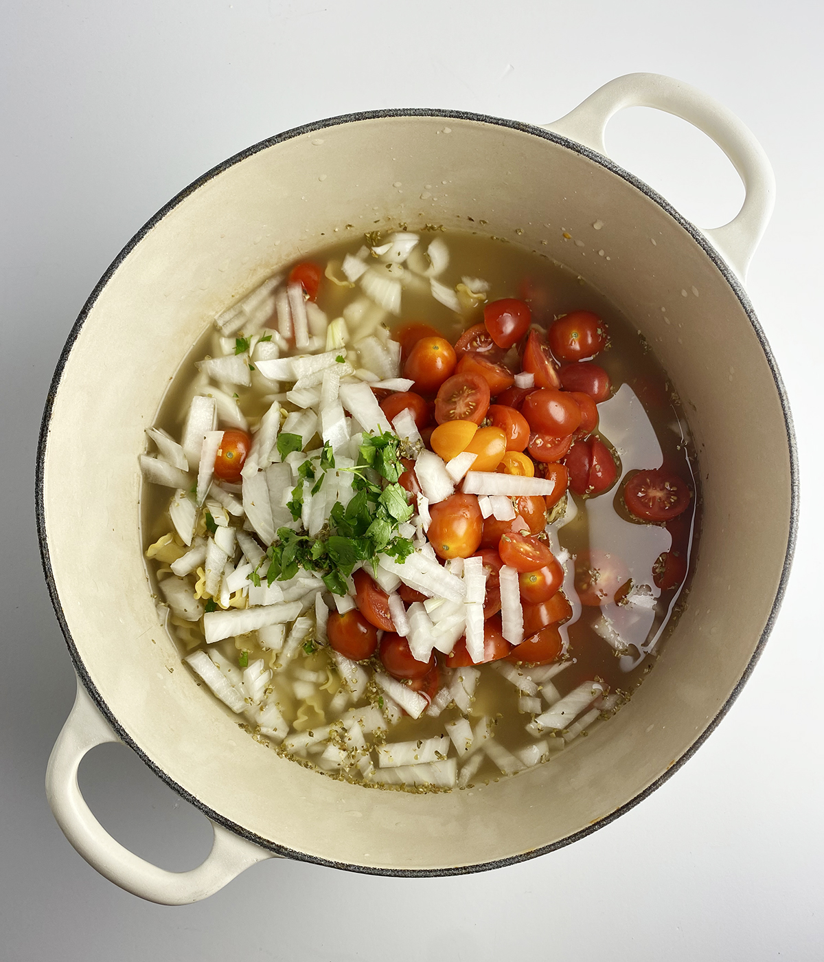 Ingredients for one pot tomato pasta in a pot.