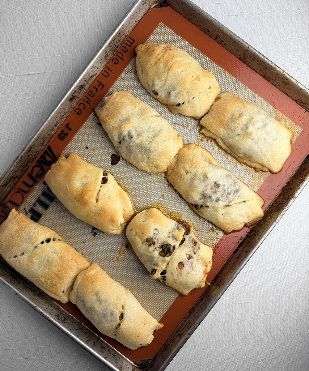 Cooked crescent roll burritos.