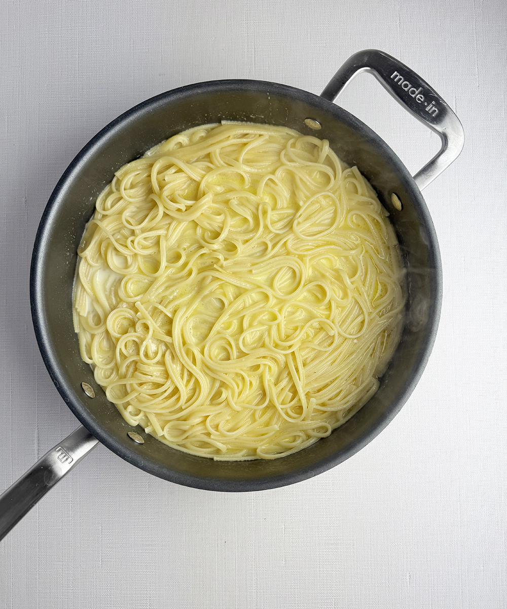 Creamy lemon pasta in a skillet.