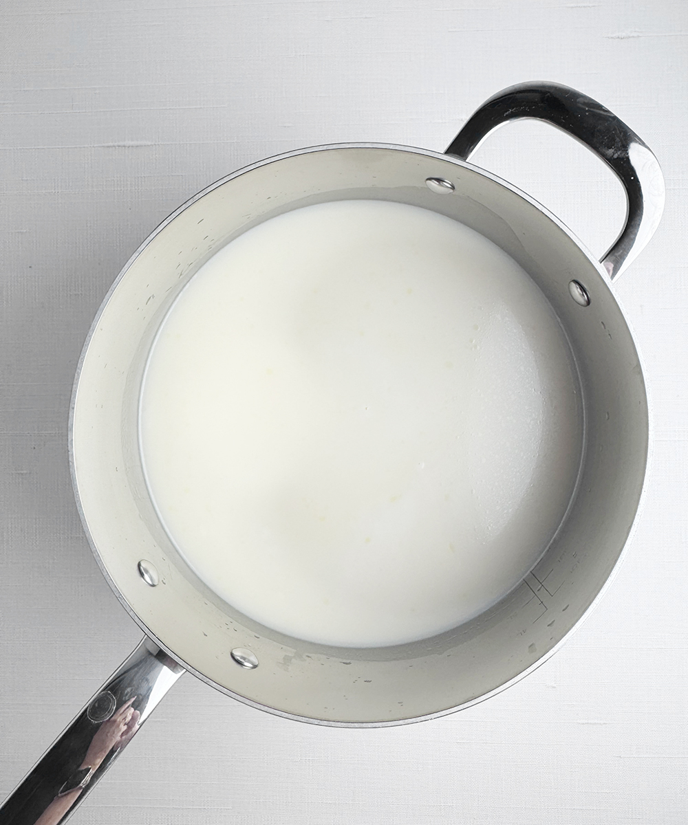 Milk and broth in a pot.